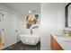 Elegant bathroom featuring a freestanding tub, modern fixtures, and stylish vanity at 1864 W 41St Ave, Denver, CO 80211