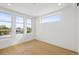 Bright bedroom with hardwood floors and several windows providing natural light at 1864 W 41St Ave, Denver, CO 80211