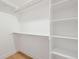 A well-organized closet featuring ample shelving space for clothes and storage at 1864 W 41St Ave, Denver, CO 80211