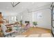 Bright living room featuring a modern fireplace, stylish furniture, and hardwood floors, with an open layout at 1864 W 41St Ave, Denver, CO 80211