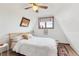 This bedroom features an exposed beam and a comfortable atmosphere at 509 Paiute Rd, Evergreen, CO 80439
