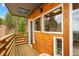 The house features a great deck perfect for entertaining and viewing the natural surroundings at 509 Paiute Rd, Evergreen, CO 80439