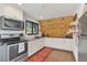 Well-equipped kitchen with modern appliances and unique wood backsplash at 509 Paiute Rd, Evergreen, CO 80439