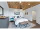 The main bedroom features a wood ceiling, ceiling fan, and great natural light at 509 Paiute Rd, Evergreen, CO 80439