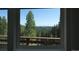 This house has an outstanding mountain view from the bedroom window at 509 Paiute Rd, Evergreen, CO 80439