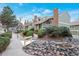 Beautiful landscaping adorns the front of these homes with green bushes and decorative rock features at 2019 S Hannibal St # C, Aurora, CO 80013