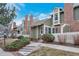 Charming townhomes featuring well-manicured landscaping, brick chimneys, and a welcoming walkway to the front door at 2019 S Hannibal St # C, Aurora, CO 80013