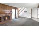 Cozy living room featuring a brick fireplace, wood paneling, and sliding glass doors at 2019 S Hannibal St # C, Aurora, CO 80013