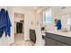 Bathroom with double vanity, walk-in shower, and large closet at 11053 Snowdon St, Parker, CO 80134