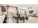 Open dining area with table, chairs, and access to back deck at 11053 Snowdon St, Parker, CO 80134