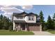 Two-story house with brown accents and a two-car garage at 11053 Snowdon St, Parker, CO 80134