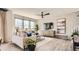 Spacious living room with large windows, a TV, and a sofa at 11053 Snowdon St, Parker, CO 80134