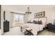 Main bedroom with large bed, stylish decor, and lots of natural light at 11053 Snowdon St, Parker, CO 80134