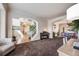 Open-concept living space with hardwood floors and seamless flow to the dining area at 20790 Bridlewood Ln, Parker, CO 80138