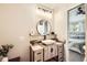 Updated bathroom featuring modern vanity with vessel sink and decorative mirror at 8264 S Fillmore Way, Centennial, CO 80122