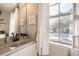 Bathroom with a vanity, mirror, and natural light from the window at 8264 S Fillmore Way, Centennial, CO 80122