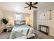 Inviting bedroom with a decorative ceiling fan, neutral walls, and carpeted floor at 8264 S Fillmore Way, Centennial, CO 80122