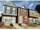 Charming townhouse row featuring varied siding colors, stone accents, and inviting entryways at 8264 S Fillmore Way, Centennial, CO 80122