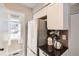 Bright kitchen featuring stainless steel appliances, white cabinets, and modern fixtures at 8264 S Fillmore Way, Centennial, CO 80122