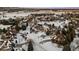 Wide aerial view of neighborhood with houses and snowy landscape at 7172 Waterford Ct, Niwot, CO 80503