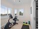 Home gym with exercise bike, weights and yoga mat at 7172 Waterford Ct, Niwot, CO 80503