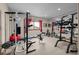 Home gym with various exercise equipment, including weights and a mirror at 7172 Waterford Ct, Niwot, CO 80503