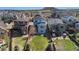 A high angle view displays a fenced backyard, landscaping and home exteriors in a residential neighborhood at 3111 Youngheart Way, Castle Rock, CO 80109