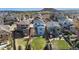 Aerial view of a neighborhood showcasing the landscaped yards and mountain views at 3111 Youngheart Way, Castle Rock, CO 80109