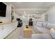 Finished basement with sofa, TV, bar area and fitness space at 3111 Youngheart Way, Castle Rock, CO 80109