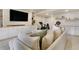 Cozy basement featuring a plush sectional sofa, TV, and a workout area at 3111 Youngheart Way, Castle Rock, CO 80109