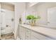 Bright bathroom features a single sink vanity with tub and shower at 3111 Youngheart Way, Castle Rock, CO 80109