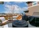 Outdoor deck featuring seating, a fire pit, and a grill, perfect for outdoor entertaining with neighborhood views at 3111 Youngheart Way, Castle Rock, CO 80109