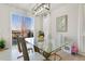 Bright dining area with a glass table and modern light fixture at 3111 Youngheart Way, Castle Rock, CO 80109