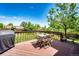 Backyard deck features a grill and dining table for outdoor entertaining and relaxation at 19706 E Bellewood Dr, Centennial, CO 80015