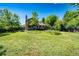 Enjoy the expansive backyard with mature trees, providing a private and picturesque outdoor space at 19706 E Bellewood Dr, Centennial, CO 80015