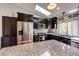 Modern kitchen featuring granite countertops, stainless steel appliances, and a skylight at 19706 E Bellewood Dr, Centennial, CO 80015