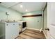 Practical laundry room with washer, dryer, and ample space, ideal for efficient chore management at 19706 E Bellewood Dr, Centennial, CO 80015