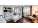 Bright living room featuring hardwood floors, neutral tones, fireplace and view to the second floor at 19706 E Bellewood Dr, Centennial, CO 80015