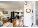 Open-concept living space with wood floors, a modern kitchen, and stylish decor with a piano at 19706 E Bellewood Dr, Centennial, CO 80015
