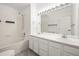 Bright bathroom with double sinks, bathtub and tiled shower at 2575 S Syracuse Way # H206, Denver, CO 80231
