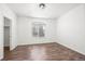 Cozy bedroom with wood floors, a window, and closet at 2575 S Syracuse Way # H206, Denver, CO 80231