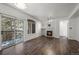 Inviting living room with fireplace, balcony access, and sleek flooring at 2575 S Syracuse Way # H206, Denver, CO 80231