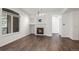 Charming living room with wood floors, fireplace, and large windows at 2575 S Syracuse Way # H206, Denver, CO 80231