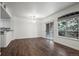 Open concept living space with wood floors, natural light, and kitchen access at 2575 S Syracuse Way # H206, Denver, CO 80231
