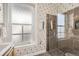 A bathroom with a frosted window and a glass enclosed shower at 1284 N Corona St # B6, Denver, CO 80218