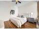 A bright bedroom with hardwood floors, fan and a comfortable bed at 1284 N Corona St # B6, Denver, CO 80218