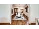 Bright dining room boasts a dining table, seating for six, hardwood floors, and seamless transition to another room at 1284 N Corona St # B6, Denver, CO 80218