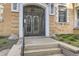 Gated entry to the apartment building, featuring secure access and classic architectural details in a well-maintained setting at 1284 N Corona St # B6, Denver, CO 80218