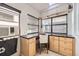 A laundry room with a desk space, natural light, and tile flooring at 1284 N Corona St # B6, Denver, CO 80218