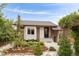 Attractive home exterior featuring well-maintained landscaping, a brick facade, and inviting front entrance at 3176 Depew St, Wheat Ridge, CO 80214